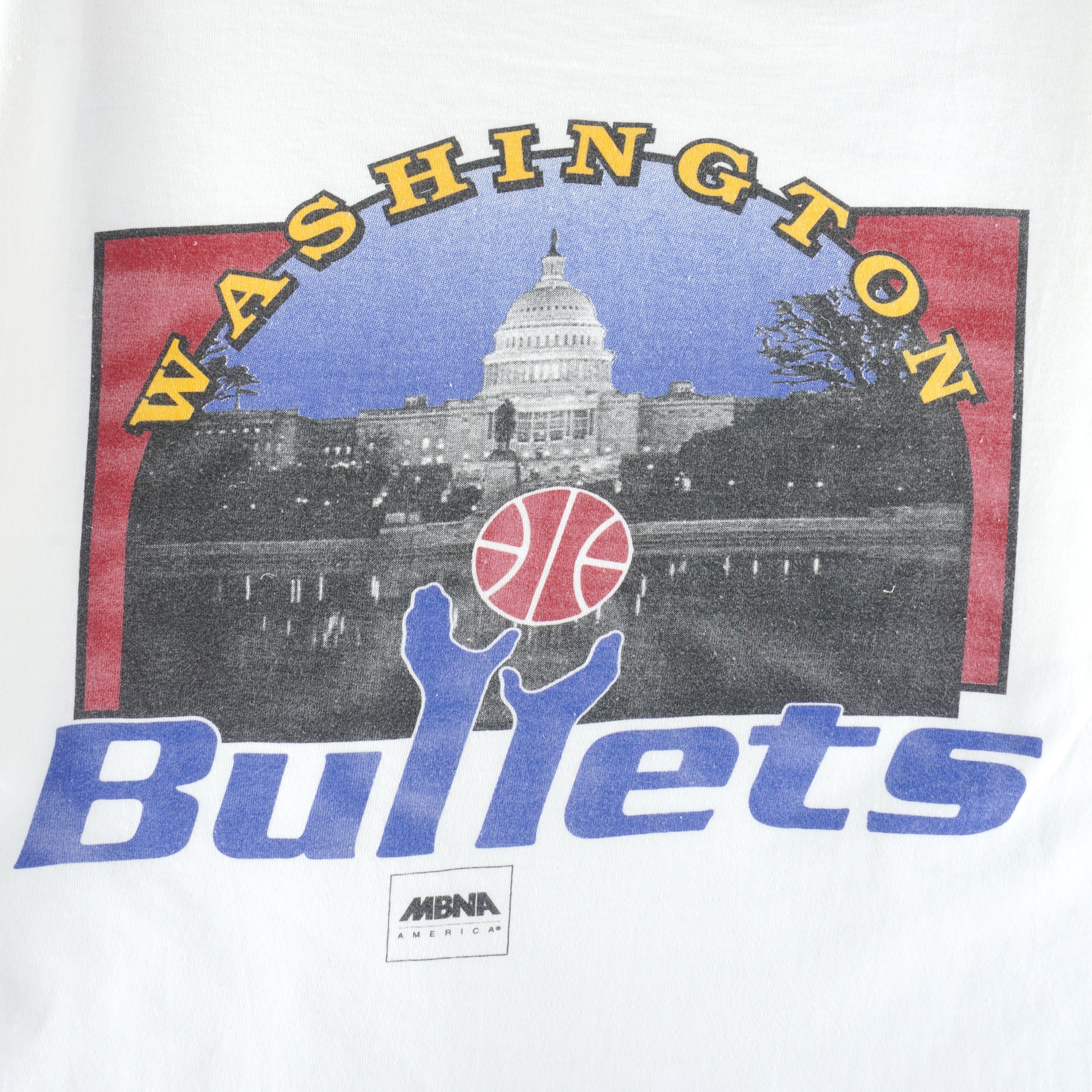 1990s Vintage NBA Washington Bullets Big Spell-Out & Logo T-Shirt by Team Champ. White in color, fits X-large size and is in excellent condition.