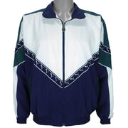1990s vintage Puma colorblock taped logo windbreaker. Dark blue, green and white in color, fitting medium in size and in excellent condition.