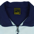 1990s vintage Puma colorblock taped logo windbreaker. Dark blue, green and white in color, fitting medium in size and in excellent condition.