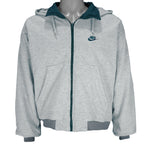1990s vintage Nike reversible colorblock jacket-to-hoodie sweatshirt. Green and grey in color with large embroidered swoosh on windbreaker side, Medium in size and is in excellent condition.