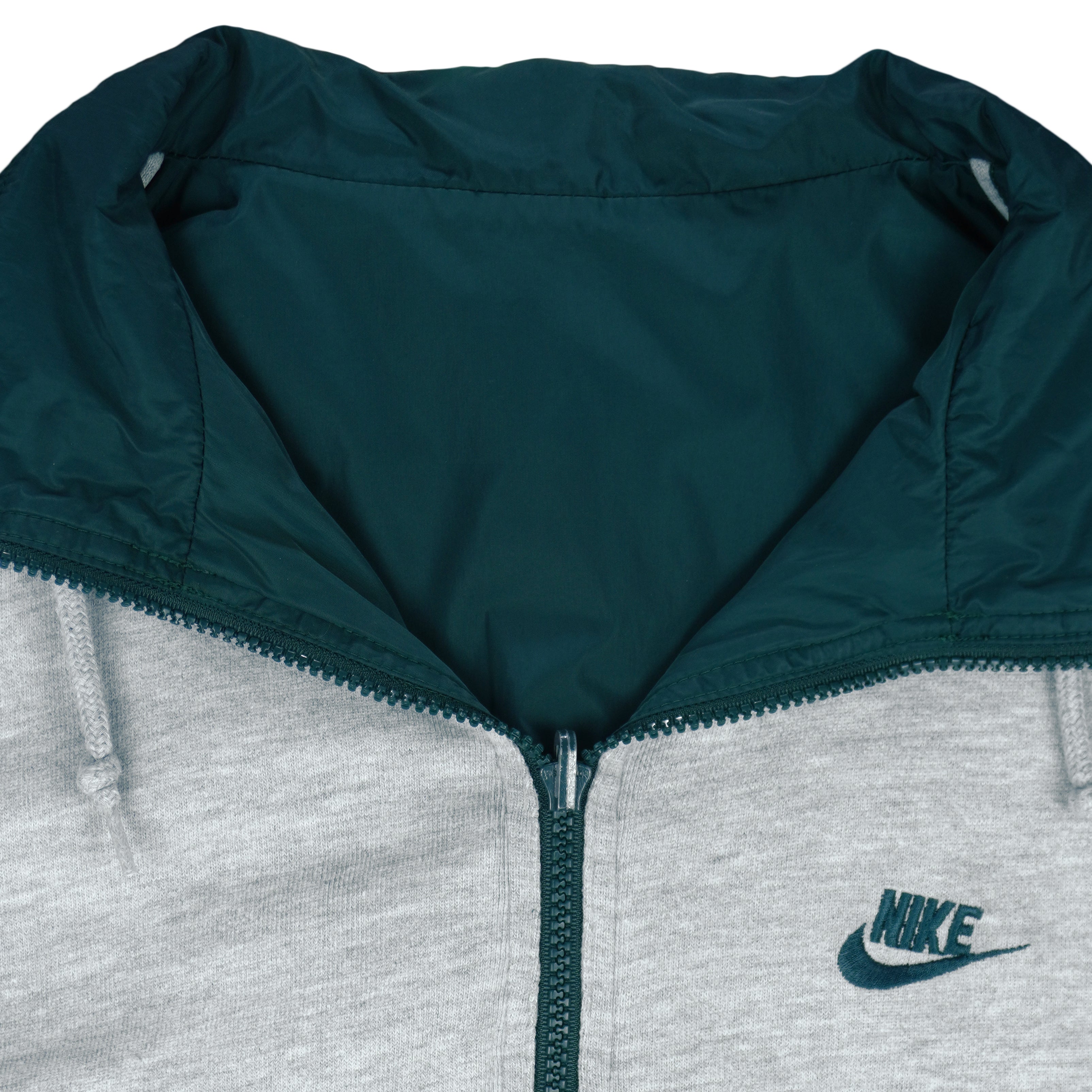 1990s vintage Nike reversible colorblock jacket-to-hoodie sweatshirt. Green and grey in color with large embroidered swoosh on windbreaker side, Medium in size and is in excellent condition.