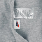 1990s vintage Nike reversible colorblock jacket-to-hoodie sweatshirt. Green and grey in color with large embroidered swoosh on windbreaker side, Medium in size and is in excellent condition.