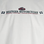 1990s vintage Tommy Hilfiger Racing work jacket. Beige in color with red and black stripes down right side and sleeves. Embroidered Hilfiger Motorcycles logo on front, back and left sleeve, Medium in size and in excellent condition.