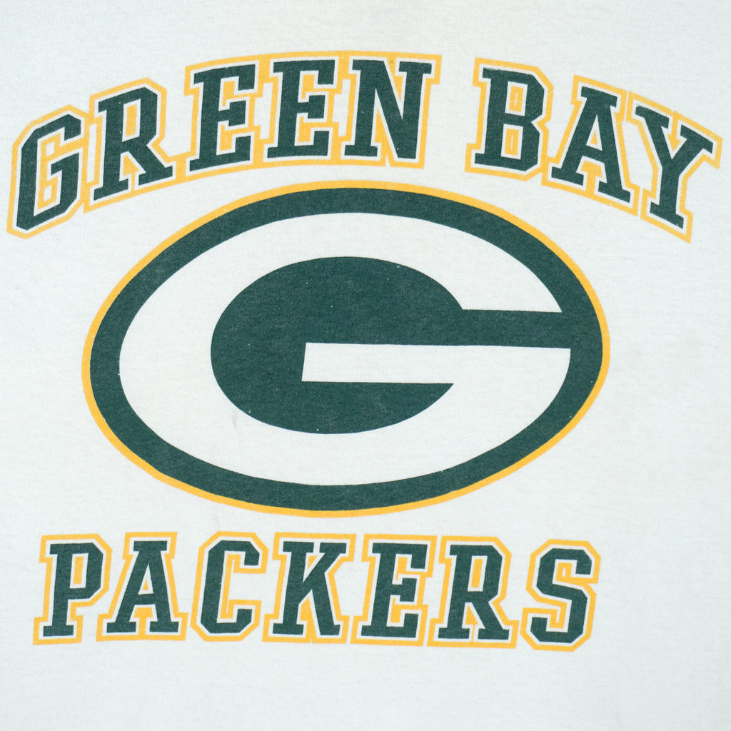 Vintage NFL Green Bay Packers spell-out and big-logo T-Shirt. White in color, fits large size and is in excellent condition.