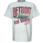 1990s vintage NHL Red Wings hockey puck T-Shirt by Fruit Of The Loom. Grey in color, with big spell-out, fits Large size and is in excellent condition