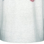 1990s vintage NHL Red Wings hockey puck T-Shirt by Fruit Of The Loom. Grey in color, with big spell-out, fits Large size and is in excellent condition