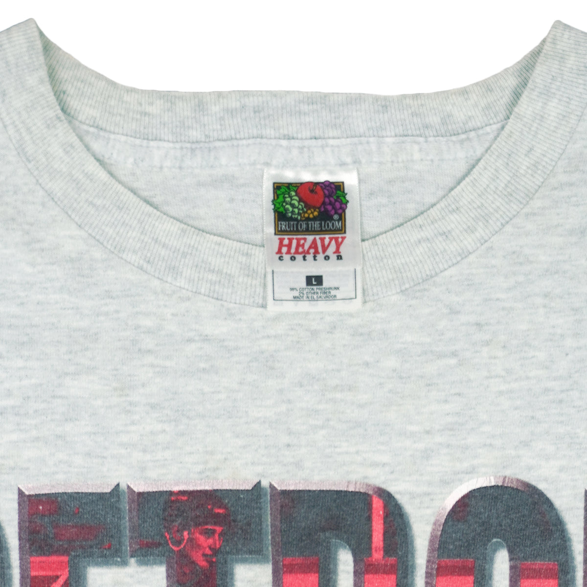 1990s vintage NHL Red Wings hockey puck T-Shirt by Fruit Of The Loom. Grey in color, with big spell-out, fits Large size and is in excellent condition