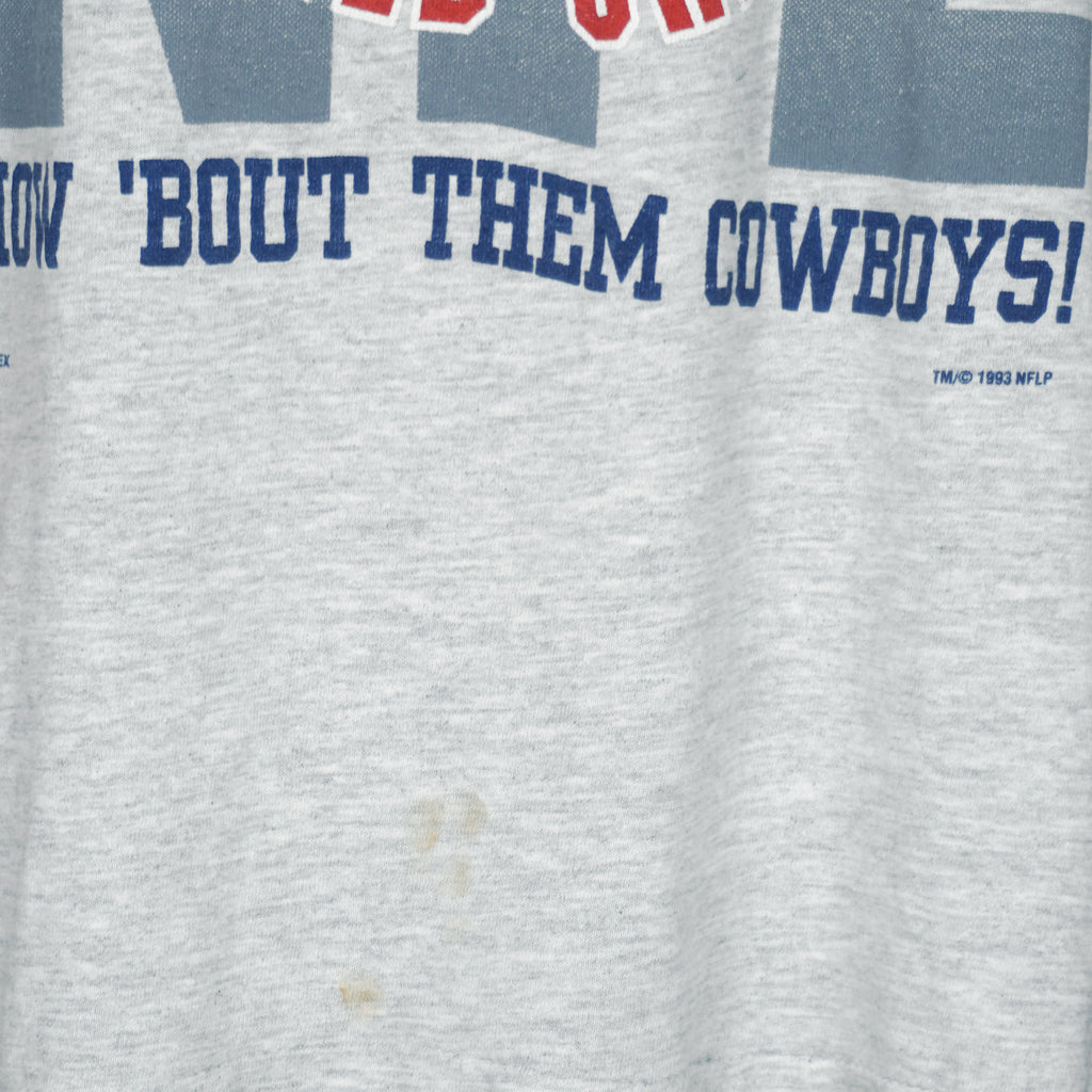 1993 vintage NFL Dallas Cowboys World champions spell-out T-Shirt. Grey in color with words "How 'Bout The Cowboys!" on front, Large in size and in very good condition.