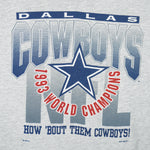 1993 vintage NFL Dallas Cowboys World champions spell-out T-Shirt. Grey in color with words "How 'Bout The Cowboys!" on front, Large in size and in very good condition.