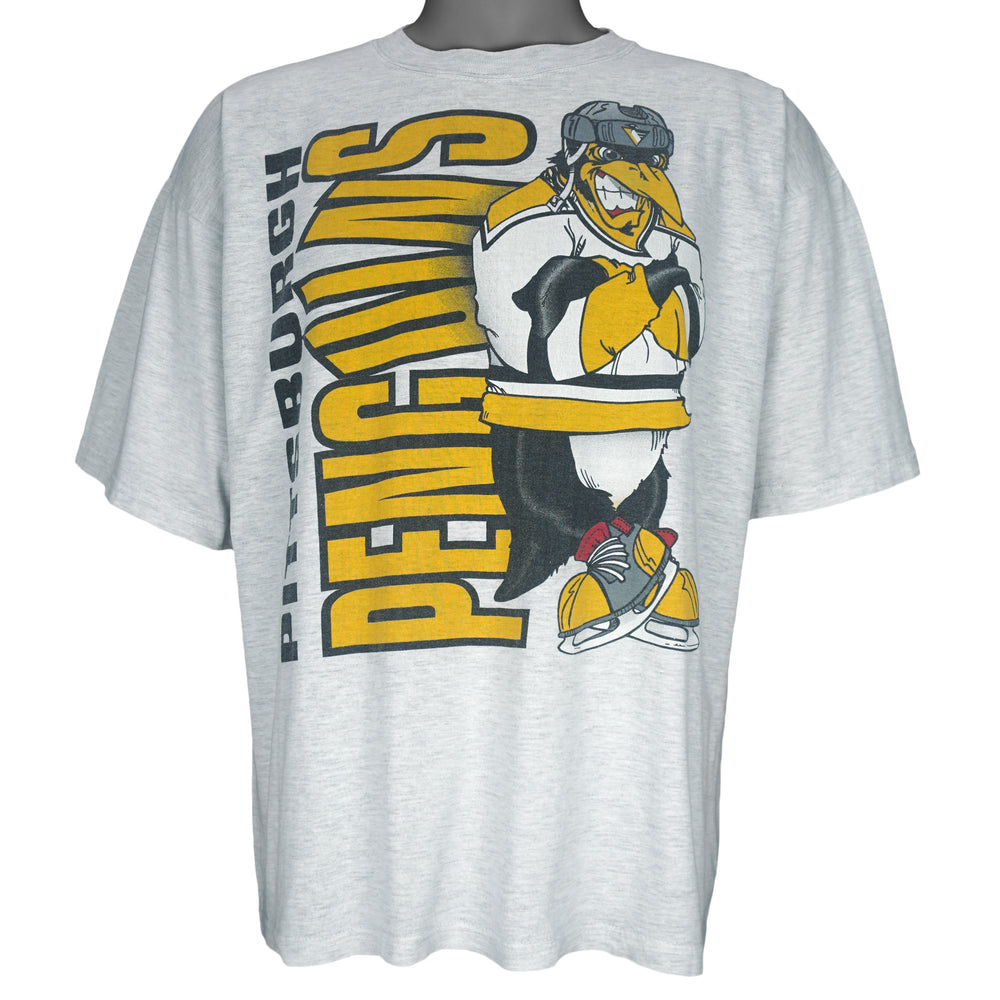 1990s vintage NHL Pittsburgh Penguins front and back printed T-Shirt. Grey in color with spell-out and cartoon penguin Iceburgh on front and back, fits X-Large in size and is in excellent condition.