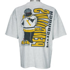 1990s vintage NHL Pittsburgh Penguins front and back printed T-Shirt. Grey in color with spell-out and cartoon penguin Iceburgh on front and back, fits X-Large in size and is in excellent condition.