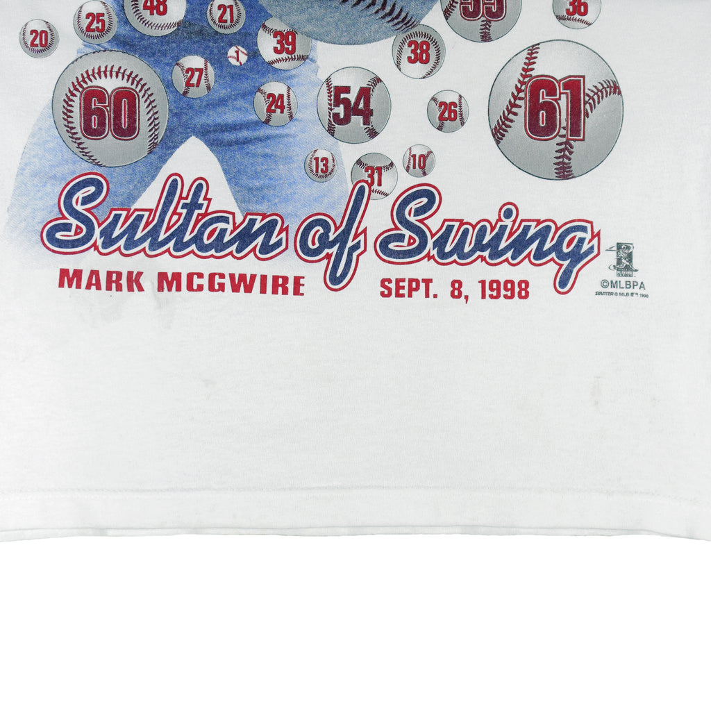 1998 vintage MLB St. Louis Cardinals Sultan of Swing Mark McGwire Single Stitch T-Shirt by Starter. White in color with spell-out and player image on front, Starter patch on left sleeve, fits Medium in size and is in excellent condition.