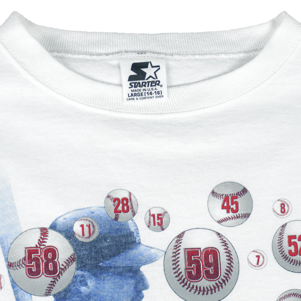 1998 vintage MLB St. Louis Cardinals Sultan of Swing Mark McGwire Single Stitch T-Shirt by Starter. White in color with spell-out and player image on front, Starter patch on left sleeve, fits Medium in size and is in excellent condition.