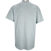 1990s vintage MLB Boston Red Sox spell-out T-Shirt by Majestic. Grey in color with bottle cap logo design, Large in size and is in excellent condition.