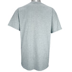 1990s vintage MLB Boston Red Sox spell-out T-Shirt by Majestic. Grey in color with bottle cap logo design, Large in size and is in excellent condition.