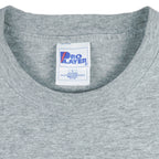 1998 vintage MLB Cleveland Indians T-Shirt by Pro Player. Grey in color with spell-out on front and Pro Player embroidered patch on left sleeve, Large in size and is in excellent condition.