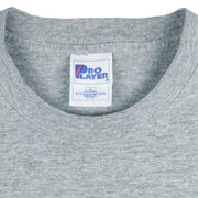 1998 vintage MLB Cleveland Indians T-Shirt by Pro Player. Grey in color with spell-out on front and Pro Player embroidered patch on left sleeve, Large in size and is in excellent condition.