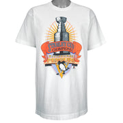 1991 vintage NHL Pittsburgh Penguins Stanley Cup Champions T-Shirt by Fruit of the Loom. White in color with large trophy print by Starter on front, fits a long Large in size and is in an excellent condition.
