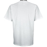 2003 vintage MLB Seattle Mariners "Road to the Show" spell-out T-Shirt by Gildan. White in color with farm team logos (Everett Aquasox, Wisconsin Timber Rattlers, Inland Empire 66ers of San Bernardino, San Antonio Missions, Tacoma Rainiers), Medium in size and is in excellent condition.