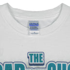 2003 vintage MLB Seattle Mariners "Road to the Show" spell-out T-Shirt by Gildan. White in color with farm team logos (Everett Aquasox, Wisconsin Timber Rattlers, Inland Empire 66ers of San Bernardino, San Antonio Missions, Tacoma Rainiers), Medium in size and is in excellent condition.