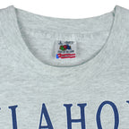 1990s vintage Oklahoma "The Sooner State" T-Shirt by Fruit of the Loom. Grey in color with various state facts and history printed on front, Large in size and is in excellent condition.