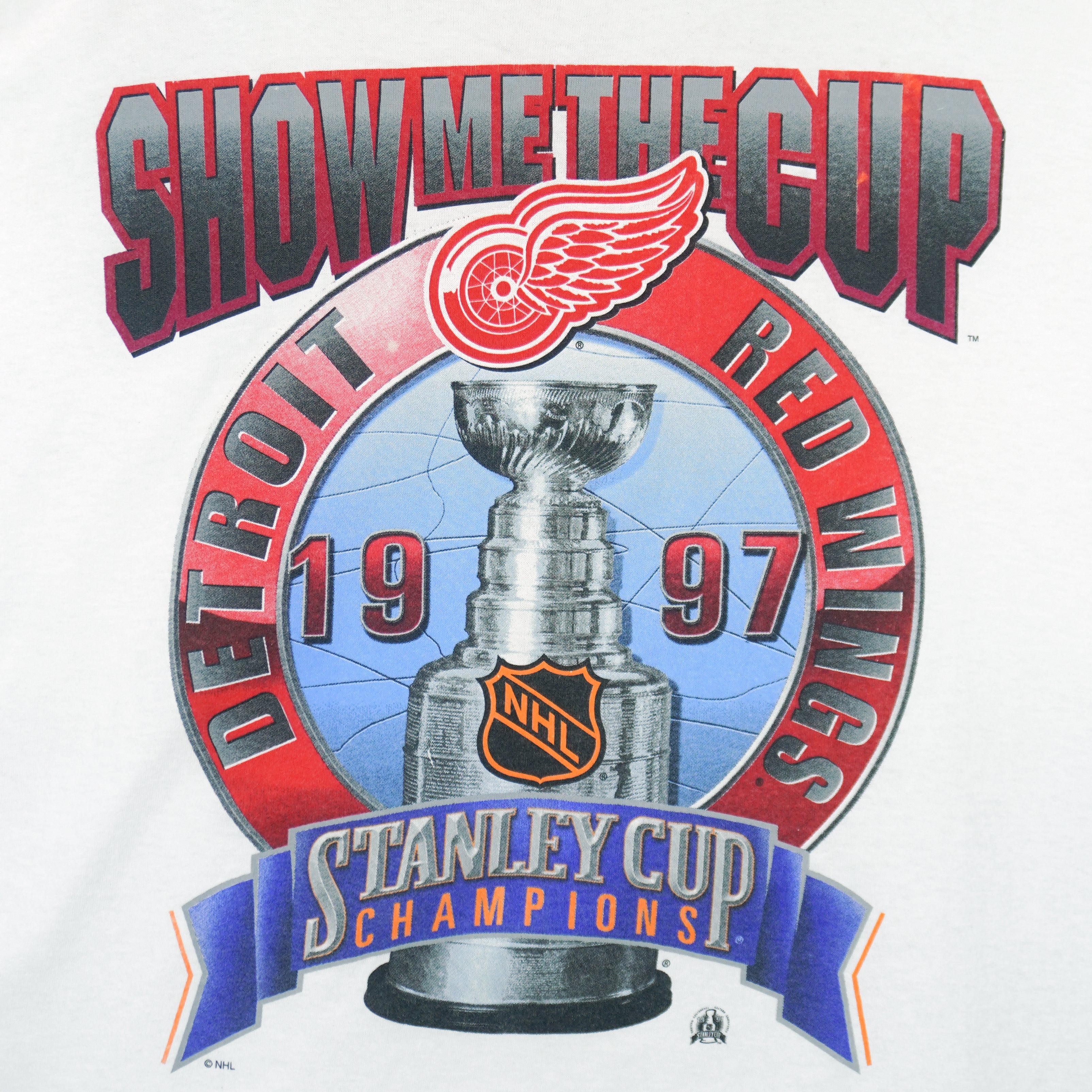 1997 vintage Starter NHL Detroit Red Wings "Show Me The Cup" Stanley Cup Champions T-Shirt. White in color with big spell-out and logo, X-Large in size and in excellent condition.