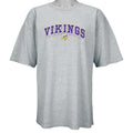 1990s vintage NFL Minnesota Vikings embroidered spell-out T-Shirt. Grey in color, fits XX-Large in size and is in excellent condition.