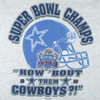 1993 vintage NFL Dallas Cowboys Super Bowl XXVII Champions T-Shirt. Grey in color with spell-out "How 'Bout them Cowboys" and helmet printed on front, fits Large in size and in excellent condition.