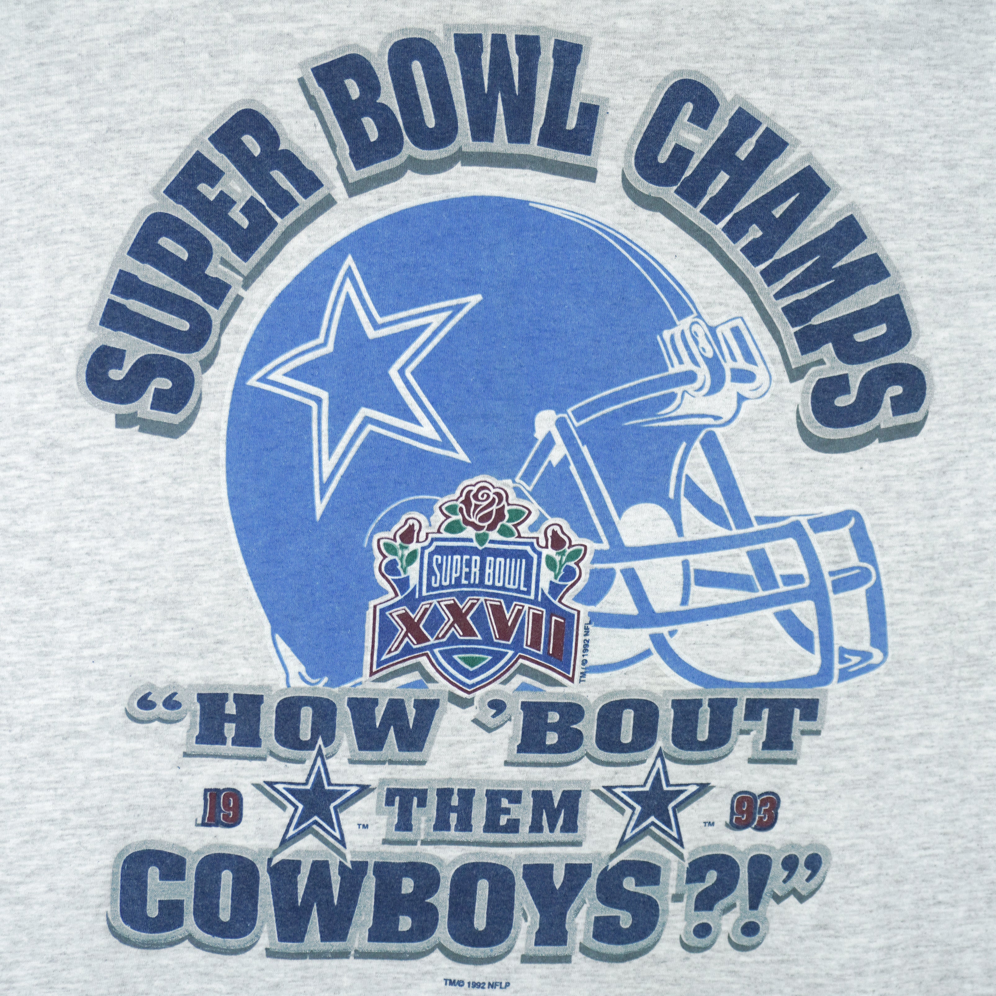 1993 vintage NFL Dallas Cowboys Super Bowl XXVII Champions T-Shirt. Grey in color with spell-out "How 'Bout them Cowboys" and helmet printed on front, fits Large in size and in excellent condition.
