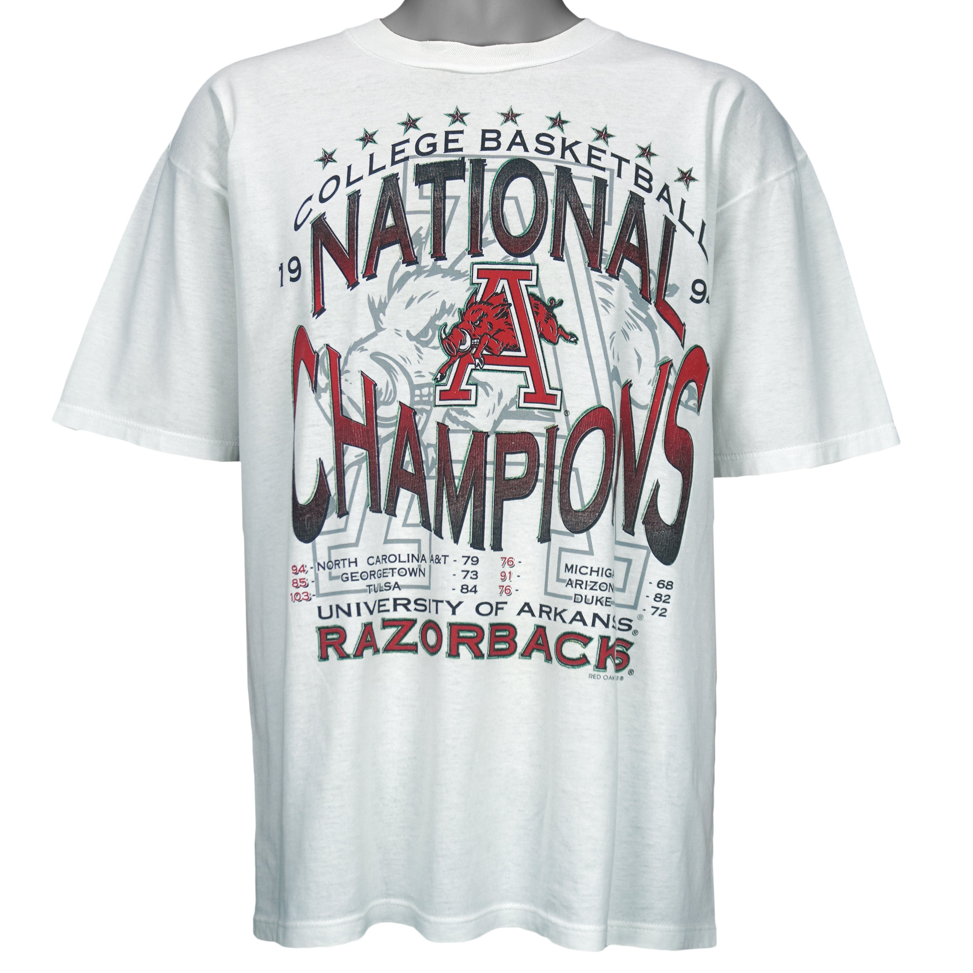1994 vintage NCAA Arkansas Razorbacks National Champions T-Shirt by Jerzees. White in color with stats spell-out printed by Red Oak Sportswear, X-Large in size and is in excellent condition.