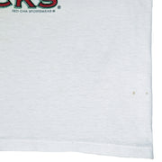 1994 vintage NCAA Arkansas Razorbacks National Champions T-Shirt by Jerzees. White in color with stats spell-out printed by Red Oak Sportswear, X-Large in size and is in excellent condition.