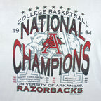 1994 vintage NCAA Arkansas Razorbacks National Champions T-Shirt by Jerzees. White in color with stats spell-out printed by Red Oak Sportswear, X-Large in size and is in excellent condition.