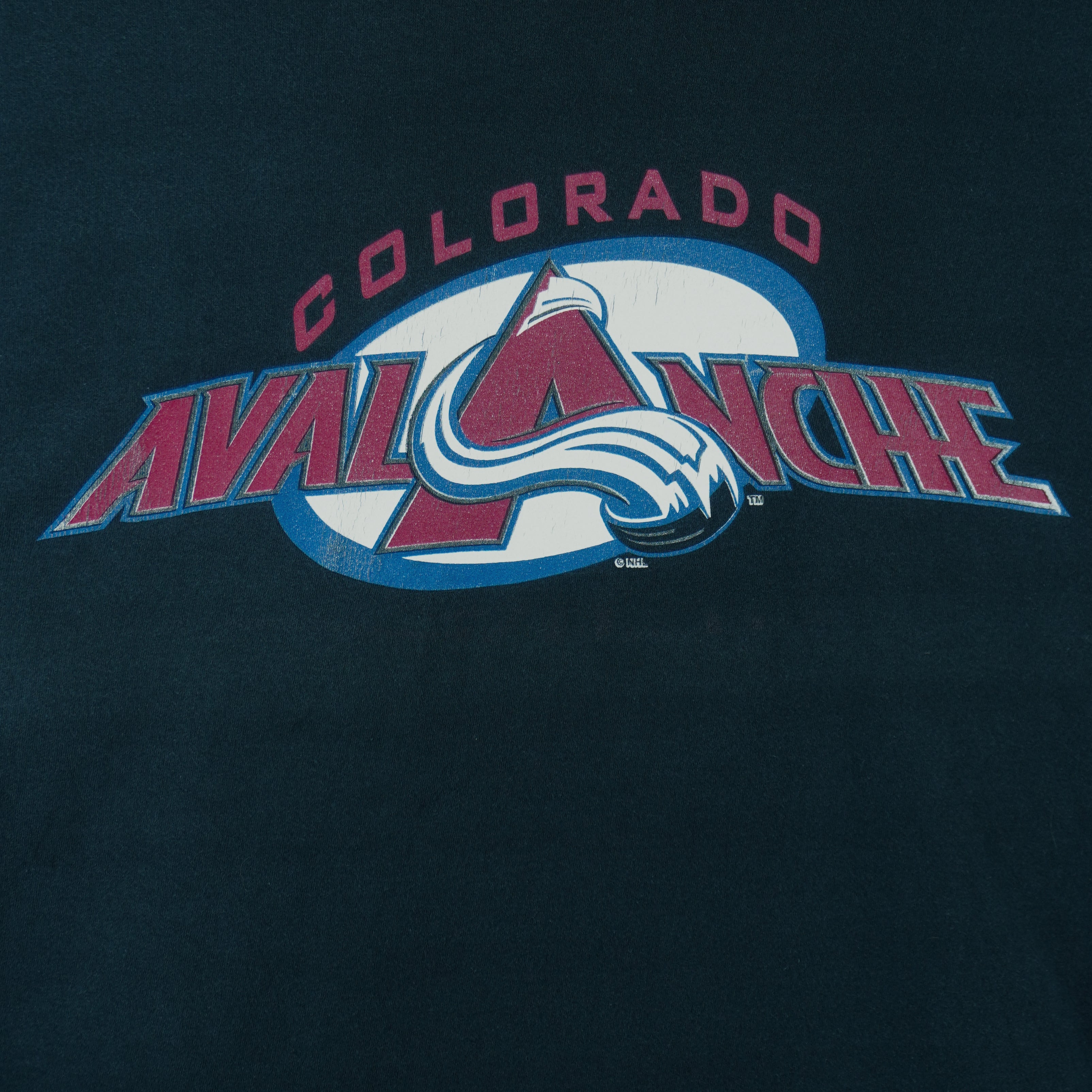 1990s vintage NHL Colorado Avalanche T-Shirt by League Leader. Black​ in color with big logo, X-Large in size and is in excellent condition.