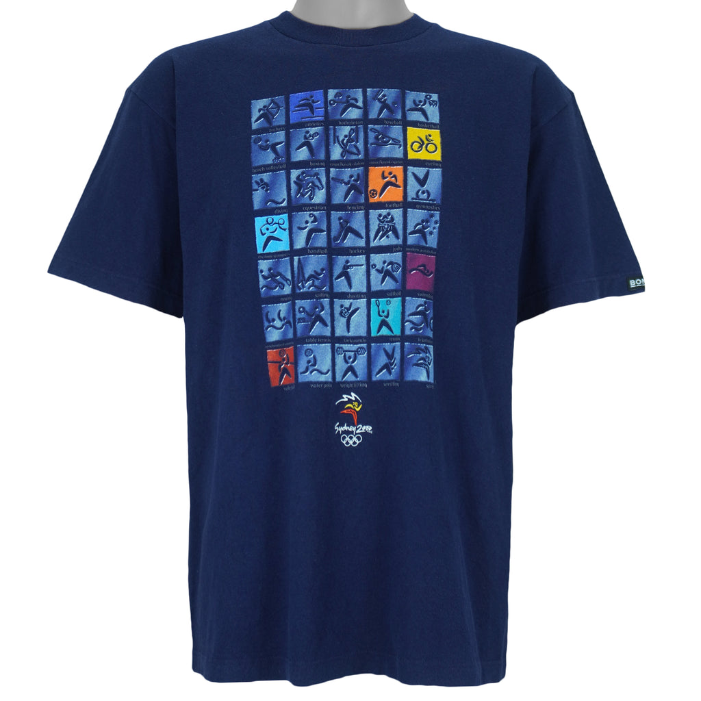 2000 vintage Sydney Summer Olympics T-Shirt by ISC, Olympic Millennium Collection. Blue in color with event icons on front, Large in size and in excellent condition.