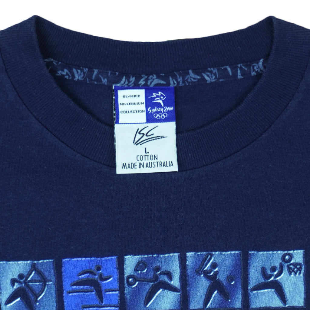 2000 vintage Sydney Summer Olympics T-Shirt by ISC, Olympic Millennium Collection. Blue in color with event icons on front, Large in size and in excellent condition.