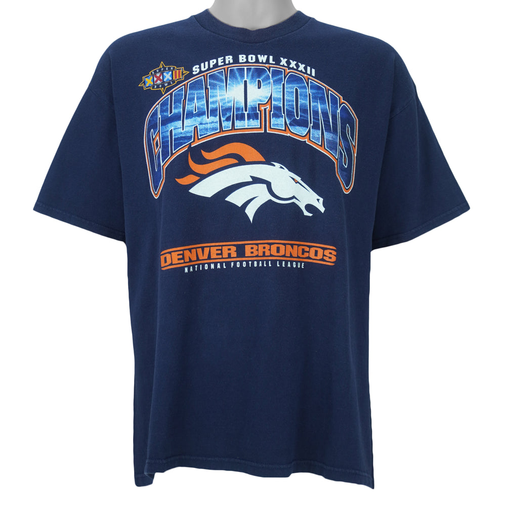 1998 vintage NFL Denver Broncos, Super Bowl XXXII Champions, T-Shirt by Lee. Blue​ in color with big spell-out and logo on front, tag is X-Large but fits Large in size and is in very good condition.