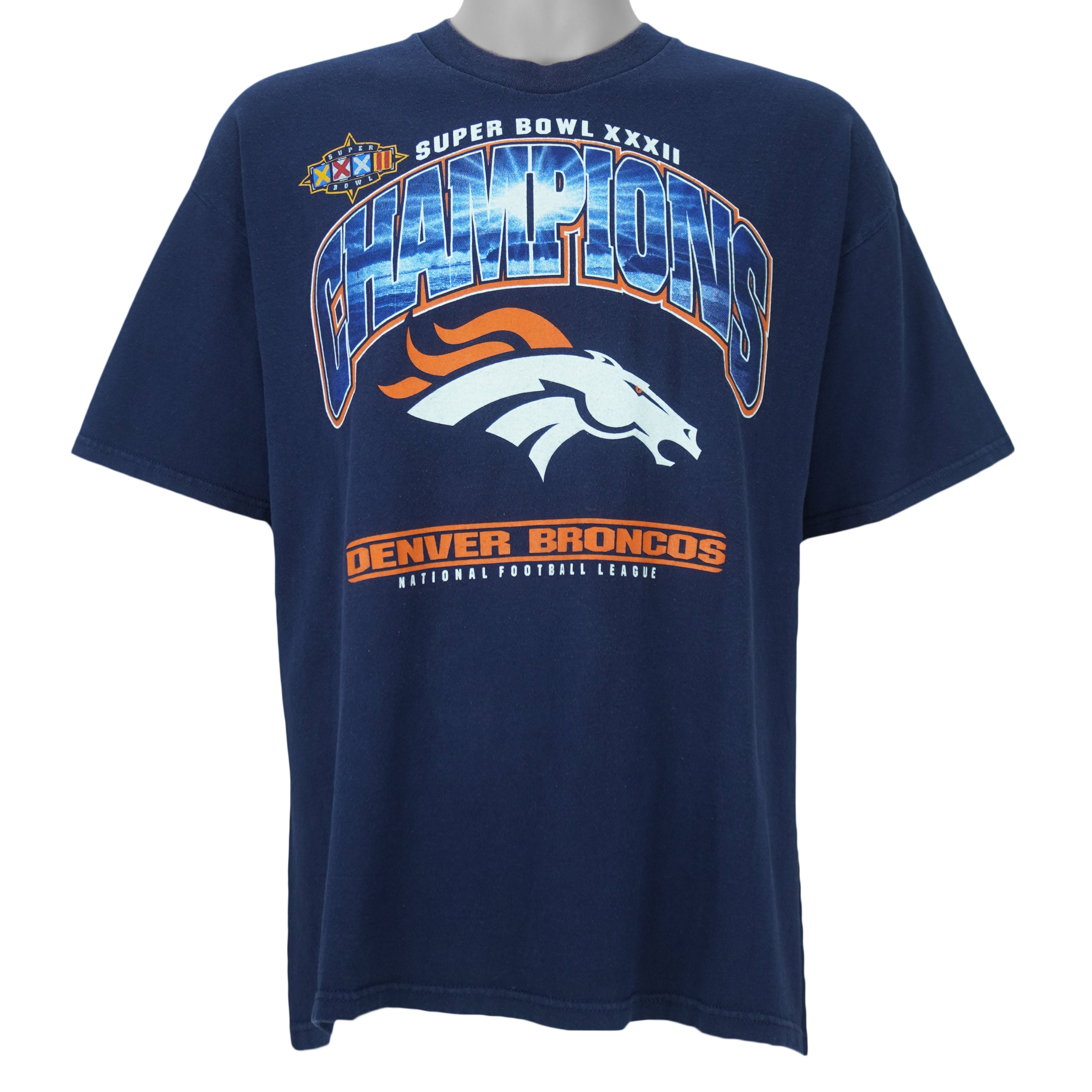 1998 vintage NFL Denver Broncos, Super Bowl XXXII Champions, T-Shirt by Lee. Blue​ in color with big spell-out and logo on front, tag is X-Large but fits Large in size and is in very good condition.