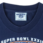 1998 vintage NFL Denver Broncos, Super Bowl XXXII Champions, T-Shirt by Lee. Blue​ in color with big spell-out and logo on front, tag is X-Large but fits Large in size and is in very good condition.