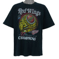 1997 vintage NHL Detroit Red Wings, Stanley Cup Champions Ring T-Shirt by Pro Player. Black in color with spell-out on front and brand emblem embroidered on left sleeve, X-Large size and is in excellent condition.