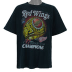 1997 vintage NHL Detroit Red Wings, Stanley Cup Champions Ring T-Shirt by Pro Player. Black in color with spell-out on front and brand emblem embroidered on left sleeve, X-Large size and is in excellent condition.