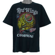 1997 vintage NHL Detroit Red Wings, Stanley Cup Champions Ring T-Shirt by Pro Player. Black in color with spell-out on front and brand emblem embroidered on left sleeve, X-Large size and is in excellent condition.