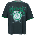 1990s vintage NBA Boston Celtics roll em ups, ringer, spell-out T-Shirt by Official Fan. Black in color with green trim, X-Large in size and is in excellent condition.