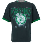 1990s vintage NBA Boston Celtics roll em ups, ringer, spell-out T-Shirt by Official Fan. Black in color with green trim, X-Large in size and is in excellent condition.
