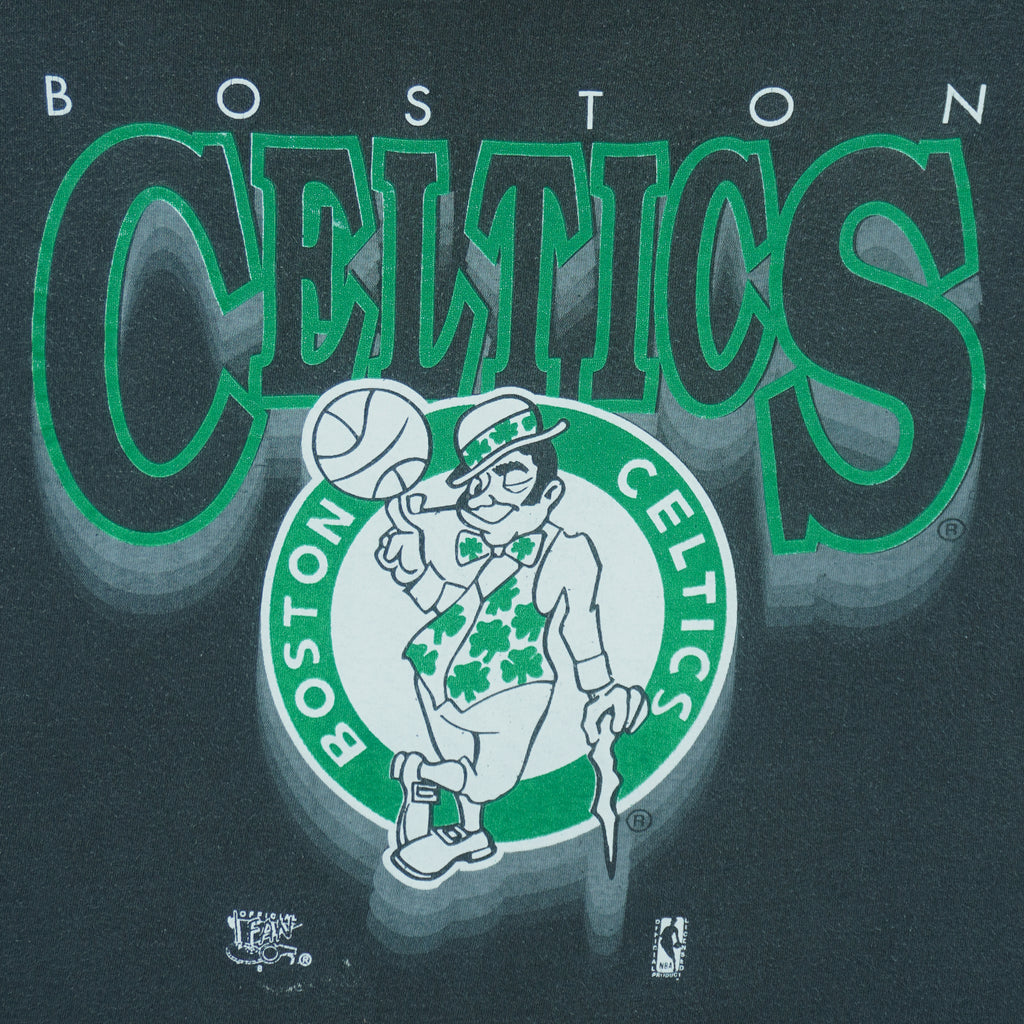 1990s vintage NBA Boston Celtics roll em ups, ringer, spell-out T-Shirt by Official Fan. Black in color with green trim, X-Large in size and is in excellent condition.