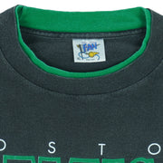 1990s vintage NBA Boston Celtics roll em ups, ringer, spell-out T-Shirt by Official Fan. Black in color with green trim, X-Large in size and is in excellent condition.