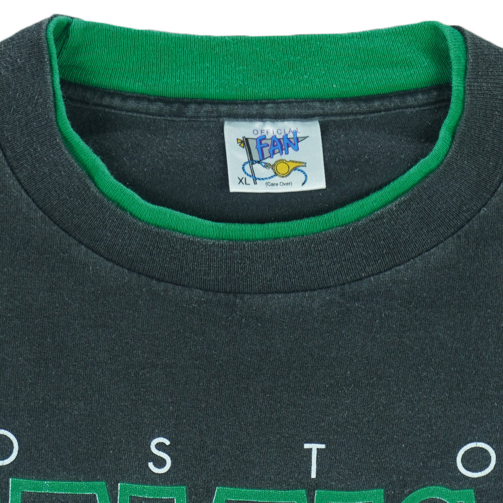 1990s vintage NBA Boston Celtics roll em ups, ringer, spell-out T-Shirt by Official Fan. Black in color with green trim, X-Large in size and is in excellent condition.