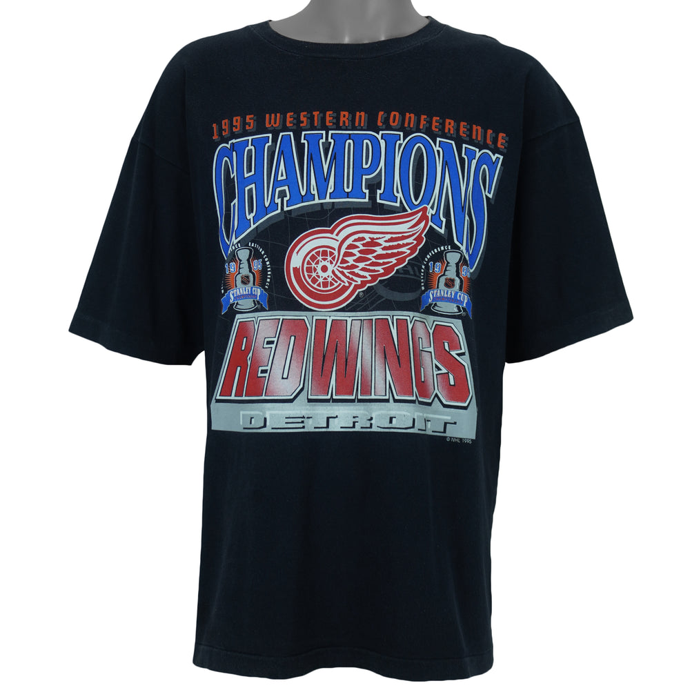 1995 vintage NHL Detroit Red Wings Western Conference Champions T-Shirt. Black in color with big spell-out and logo on front, fitting X-Large in size and is in excellent condition.
