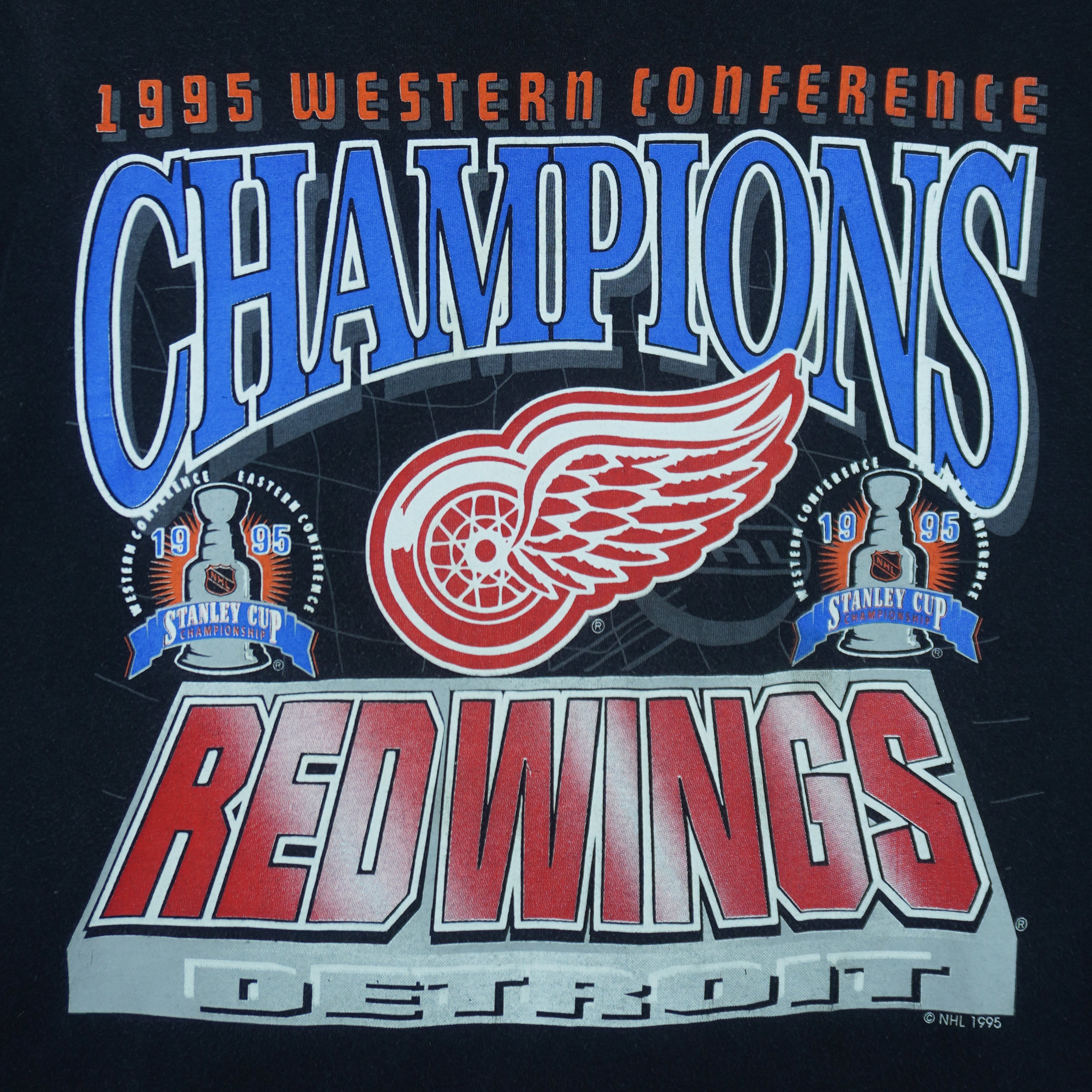 1995 vintage NHL Detroit Red Wings Western Conference Champions T-Shirt. Black in color with big spell-out and logo on front, fitting X-Large in size and is in excellent condition.
