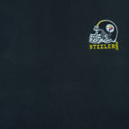 1990s vintage NFL Pittsburgh Steelers embroidered T-Shirt by Logo Athletic. Black in color with patch above right breast and on left sleeve, fits X-Large and is in excellent condition.