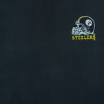 1990s vintage NFL Pittsburgh Steelers embroidered T-Shirt by Logo Athletic. Black in color with patch above right breast and on left sleeve, fits X-Large and is in excellent condition.